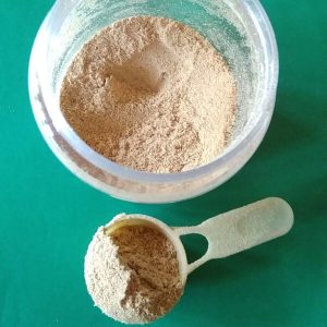 Cream-coloured Kasthuri Manjal, or Musk Turmeric, is shown as a fine powder in a container and scoop from Wayanad, Kerala's glow-skin herb.